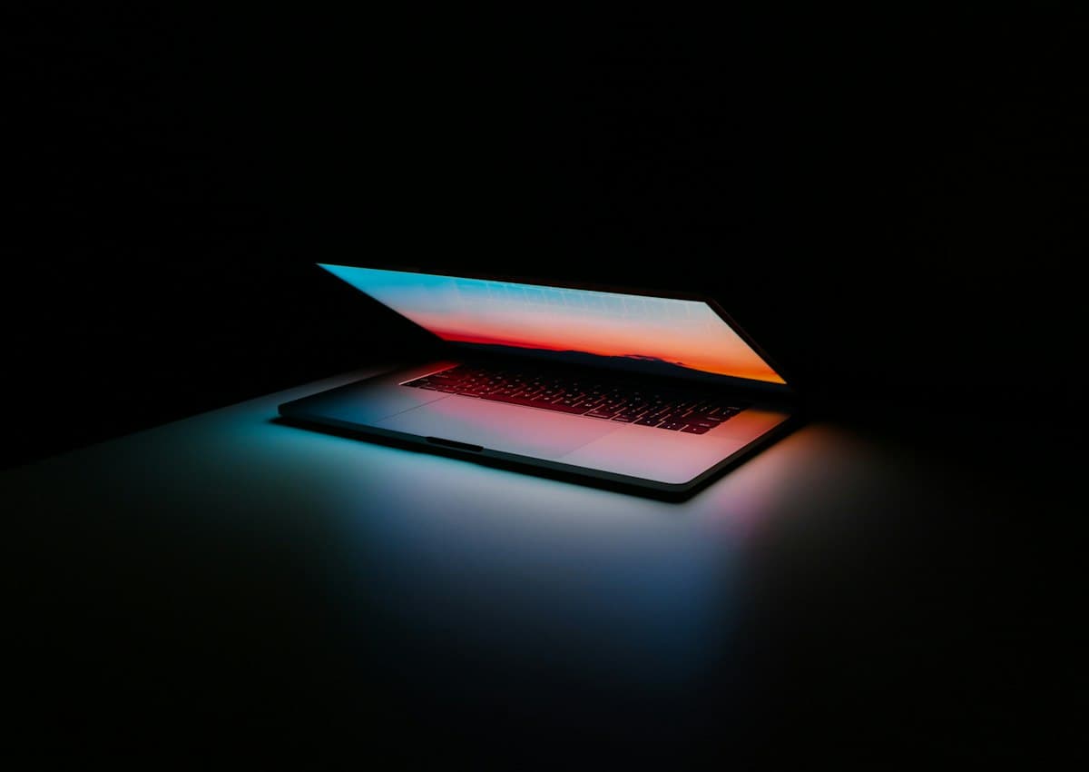 A laptop glowing in the dark
